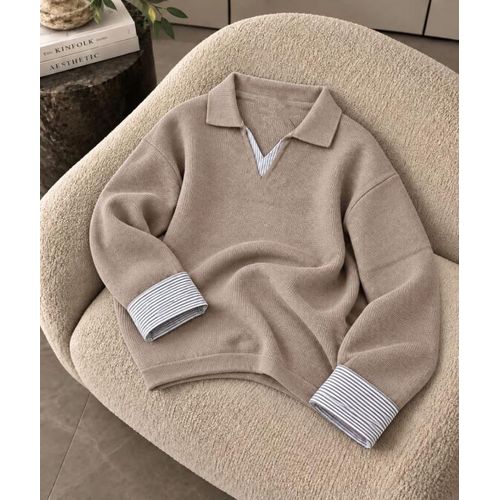 A distinctive pullover blouse with a unique texture.