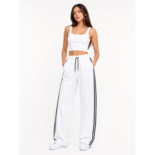 Women's wide-leg trousers featuring linear designs.