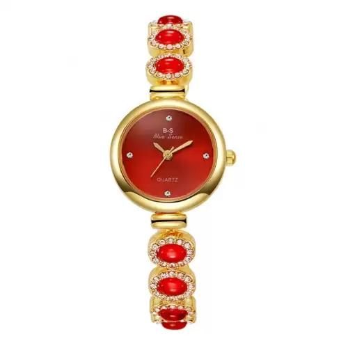 Elegant women's watch with a bracelet adorned with sparkling red crystals