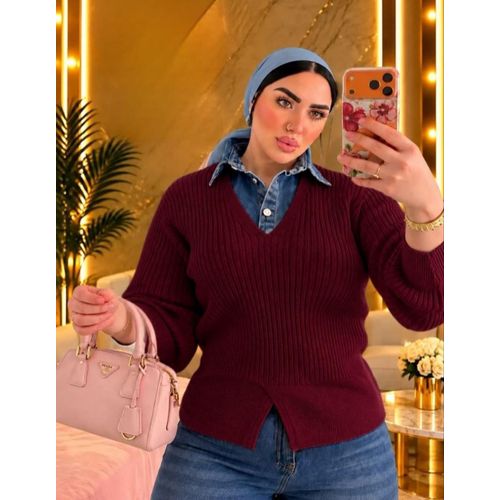 A distinctive pullover blouse with a unique texture.