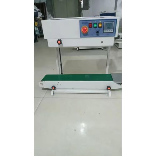 Continuous horizontal and vertical bag sealing machine equipped with a date printer