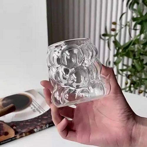 Modern glass mug with a wavy bubble design - an elegant cup for iced coffee, lattes, juices, breakfast milk, and desserts