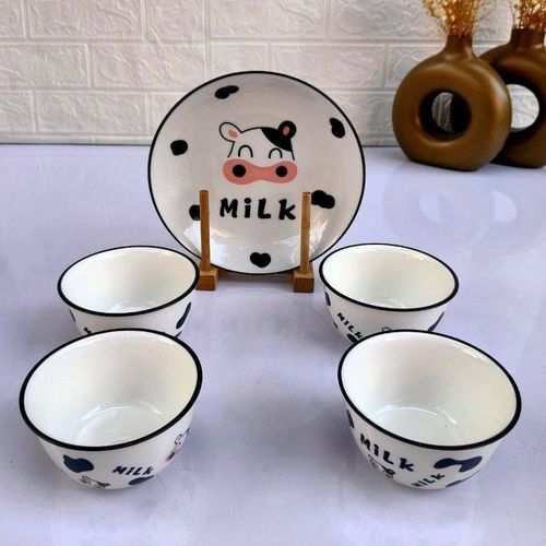 white porcelain bowl set with cow design piceces