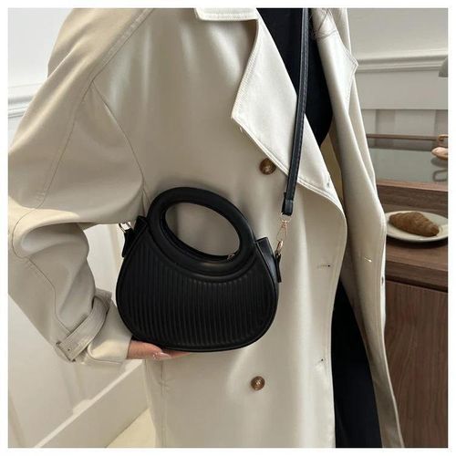 Round crossbody bag with a round handle and a striped design