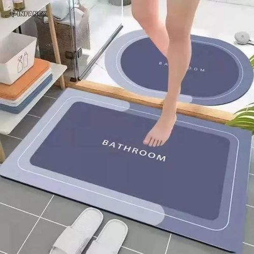 A rectangular bath mat made of blue PVC and technical velvet, machine-made, highly absorbent, non-slip, quick-drying, and dirt-repellent. Available in size 50 x 80 cm.