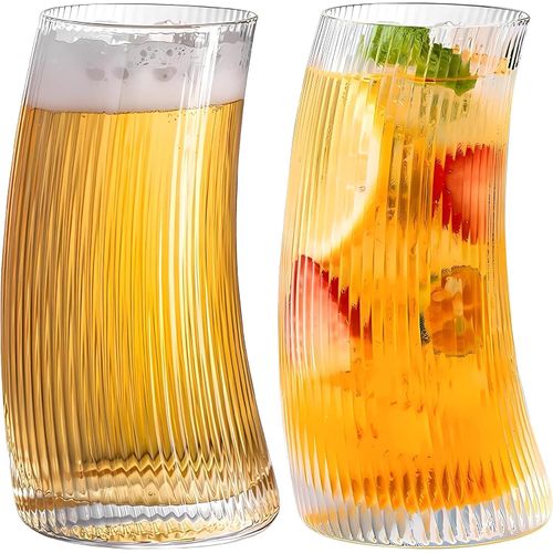 A set of distinctive glass cups with a modern ribbed and slanted design, consisting of 6 pieces. Ideal for serving juices and cold drinks with a luxurious touch and unique elegance. Durable and high q