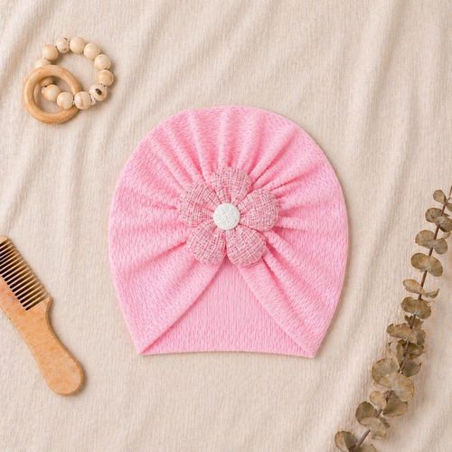 An elegant flower-adorned turban hat for infants a practical, flexible, and delicate baby turban. This ready-to-wear headpiece is perfect for newborns and baby girls an ultra-soft and stretchy baby headband.