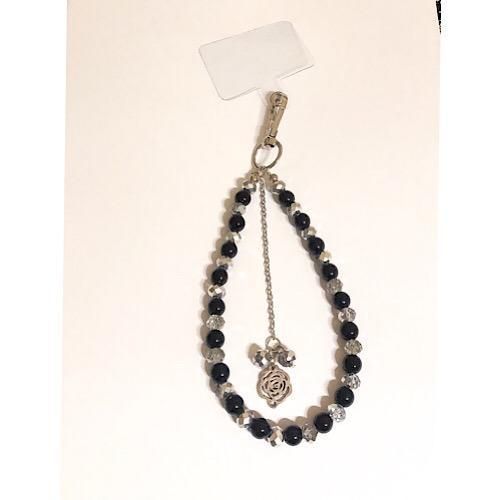 A beautiful phone strap of black and silver beads