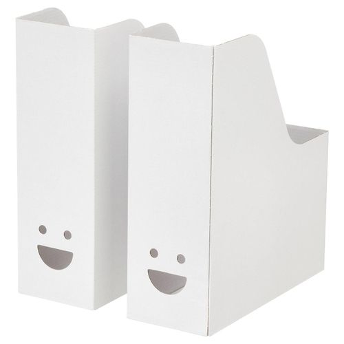Magazine file Two white TJABBA magazine files, made from 100% recycled cardboard, with cheerful faces. Upright, rectangular with a slanted top.