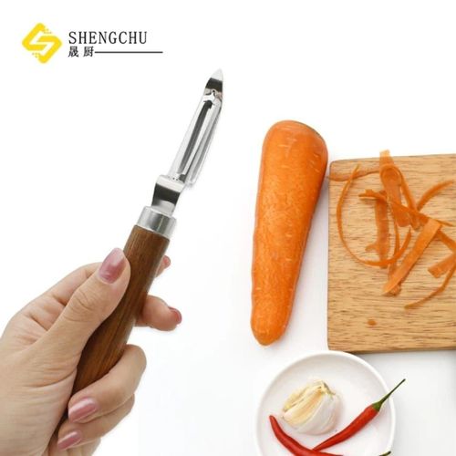 Vegetable peeler and scraper