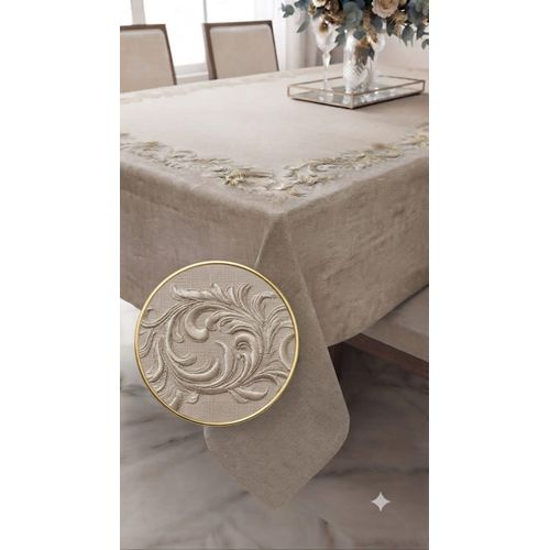 A high-quality beige linen tablecloth featuring tone-on-tone embroidery (240 x 145 cm), it adds beauty and elegance to your dining table.