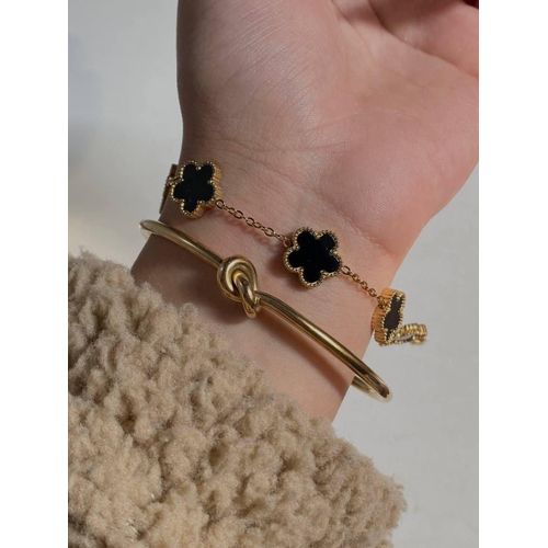 Women's 2-Piece Golden Bracelet Set - Featuring a Stylish Minimalist Knot Cuff Bangle and a Dainty Chain Bracelet with Elegant Black Flower Charms - A Sophisticated Layered Jewelry Set for Modern Elegance.