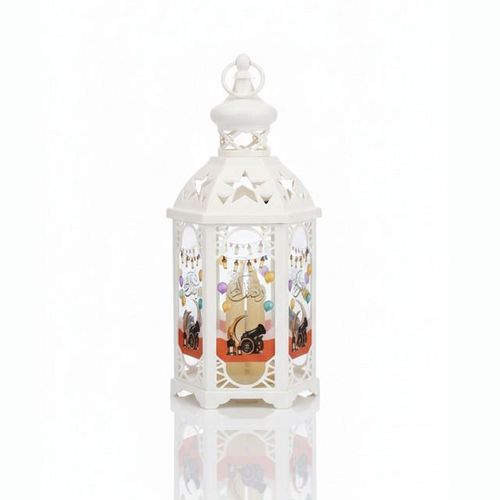 A hexagonal Ramadan lantern in white with an Islamic design and warm lighting