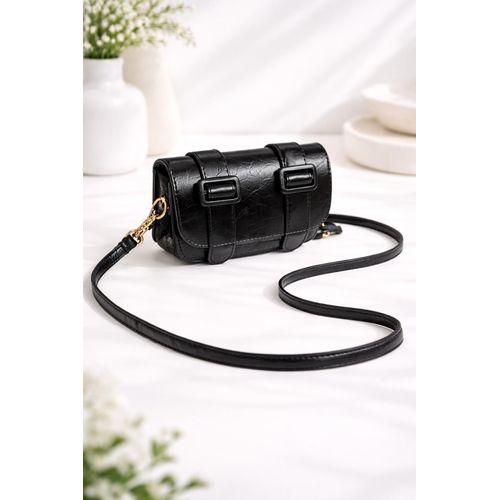 Stylish small leather crossbody bag for girls, modern design with a long strap and double clasp.