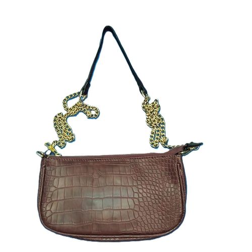 brown crocodile-embossed mini shoulder bag with a gold chain strap and black adjustable shoulder strap.