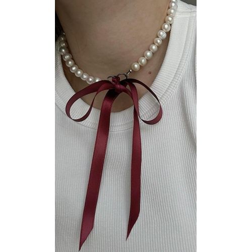 Elegant pearl choker with satin Bow