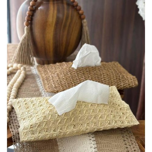A knitted tissue box cover with a modern bohemian design for home decor.