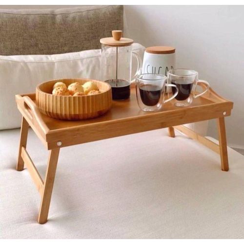 Our breakfast table is simply made of imported bamboo wood it can be used as a table or a regular tray.