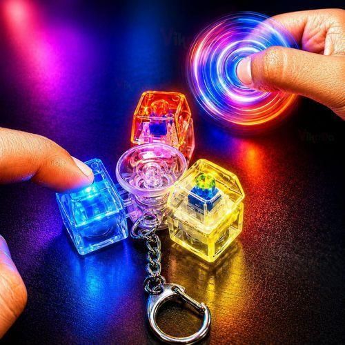 2-in-1 Spinner and Light-Up Mechanical Button Keychain Features three colorful buttons a central bearing and a metal hook designed for stress relief suitable for children teens and adults (shape and color may vary).