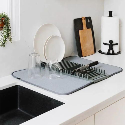 A water-absorbent mat with a dish and cutlery holder a practical design for drying and organizing dishes protects surfaces from moisture and scratches.