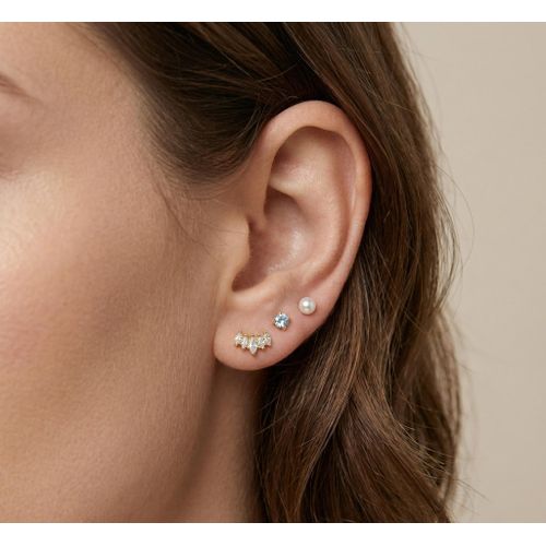 set of three pairs of gold-toned stainless steel stud earrings