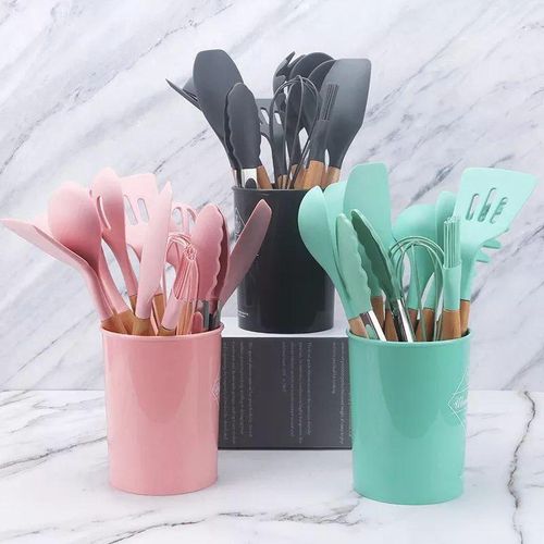 12 piece cooking utensil set made of silicone with wooden handles non stick and scratch resistant with a plastic holder
