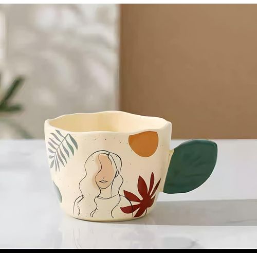 Ceramic Coffee- Exclusive with abstract face pattern and sculpted paper handle, Designed for aesthetic appreciation, Fits perfectly in the hand, Suitable for fine drinks, Enhances table settings, Idea
