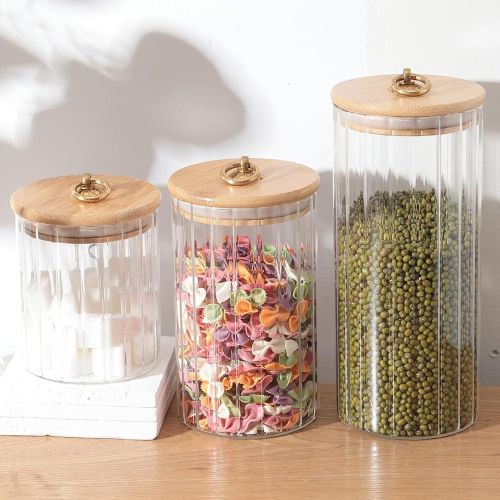 Glass storage jars with wooden lids, 3-piece set, striped design with gold ring, airtight kitchen containers in 3 different sizes.