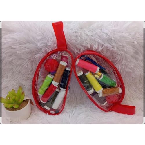 A bag Of Multi-colored Thread Spools + Sewing Needles, Scissors, And Sewing Supplies