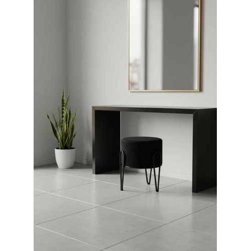 A perfect round pouf with a metal base – a luxurious design for the home