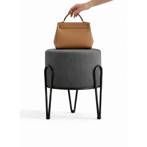 A perfect round pouf with a metal base – a luxurious design for the home