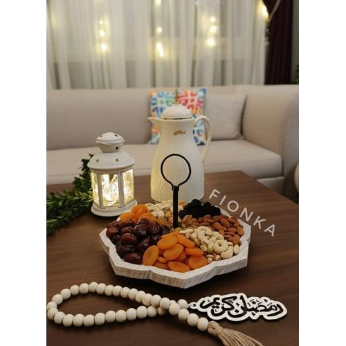 Dates, nuts, dried fruits, juices, coffee and qatayef (a type of sweet pastry) carrier