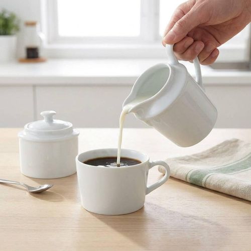 porcelain milk jug for serving at the dining table. A convenient porcelain milk jug for serving milk at home, the perfect choice for you. Made of high-quality white porcelain. Quantity: 1 piece.