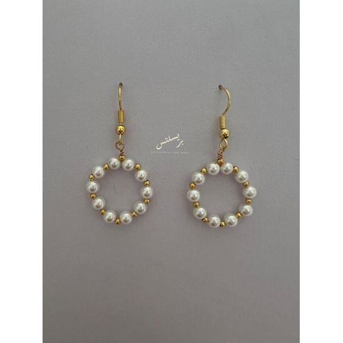 Stunning hoop style dangle earrings that effortlessly combine classic white pearls with a modern gold accent