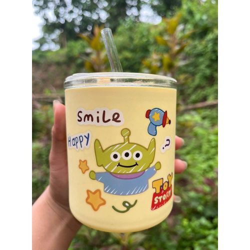 Glass cup with straw