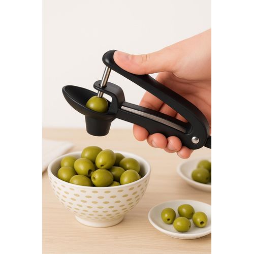 Manual tool for removing pits from olives, cherries, and dates – practical and easy-to-use design