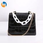 Crocodile patterned handbag and stone patterned crossbody bag