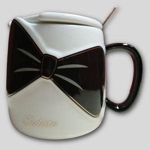 Ceramic mug with spoon and lid