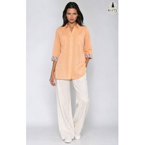 Casual linen womens shirt in light orange with decorative cuffs 