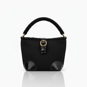 Elegant women's handbag with a modern bucket design, luxurious black color with a fur-trimmed top handle, leather strap closure, and gold buckle. Size: 20x17