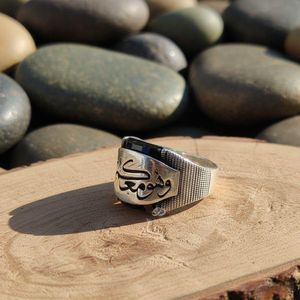sterling silver men's ring with Arabic calligraphy and a black gemstone