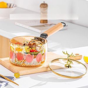 وعاء زجاجي شفاف بتصميم عصري مع طبعة زهور وغطاء أنيق
