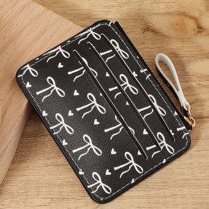 SHEIN محفظة كروت نسائية سوداء بطبعة فيونكة وقلوب – بسحاب