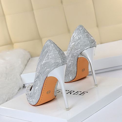 Gold High Heels Shoes Woman for Fashion. Beautiful Luxury High-Heeled Shoe,  Front View. A Pair