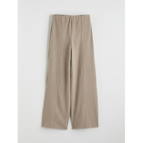 Effortless Elegance Meets Everyday Comfort in Our Wide-Leg Trousers, Designed With A Flattering Elasticated Waist.