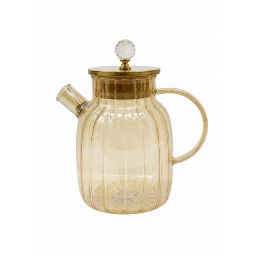 Pyrex glass kettle with a golden lid and glass handle