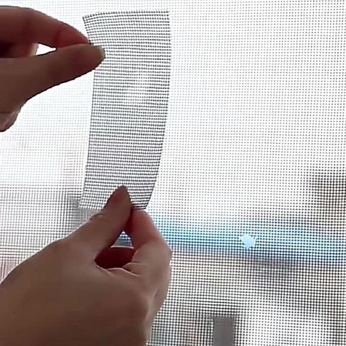 Adhesive tape for repairing holes and tears in window and door screens